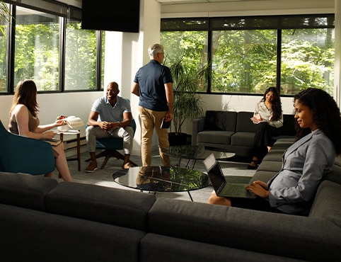 A group of Benjamin Moore employees utilizing a corner lounge area at the Montvale office. A group of Benjamin Moore employees utilizing a corner lounge area at the Montvale office.