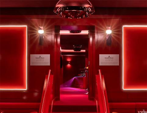 Benjamin Moore’s red-painted hospitality lounge at Madison Square Garden with red lighting.   Benjamin Moore’s red-painted hospitality lounge at Madison Square Garden with red lighting.