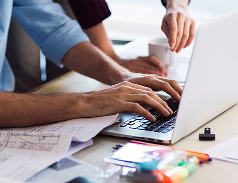 Architects working at a computer Architects working at a computer