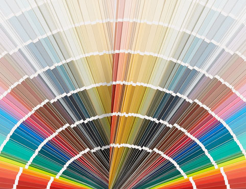 A fan deck of paint colors represents all color families. A fan deck of paint colors represents all color families.