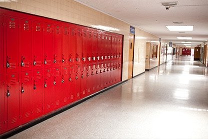 A bank of red, impact-resistant lockers offer both longevity and aesthetic appeal when sealed with high durability enamel coating. A bank of red, impact-resistant lockers offer both longevity and aesthetic appeal when sealed with high durability enamel coating.