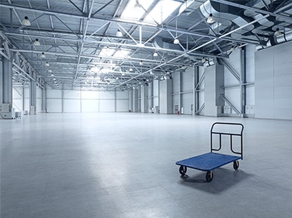 A huge warehouse floor withstands any level of abuse–and still looks great–with epoxy floor coatings. A huge warehouse floor withstands any level of abuse–and still looks great–with epoxy floor coatings.