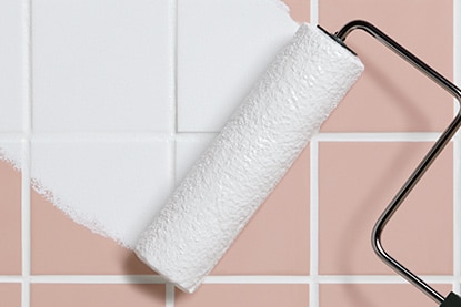 Paint roller painting over bathroom tile Paint roller painting over bathroom tile