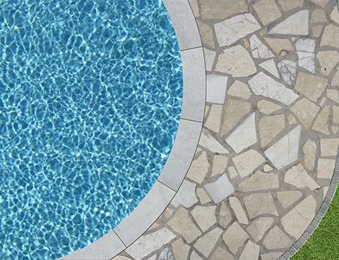 Inground swimming pool with stone decking Inground swimming pool with stone decking